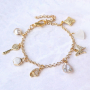 Pendientes y pulseras de tendencia con colgantes y entrepiezas con zirconia: