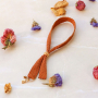 Dise&ntilde;a pulseras y cordones para el tel&eacute;fono con cinta 