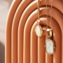 Ideas creativas con colgantes de acero inoxidable y concha para crear joyas