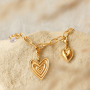 Crea divertidos collares y pulseras con colgantes de coraz&oacute;n de acero inoxidable